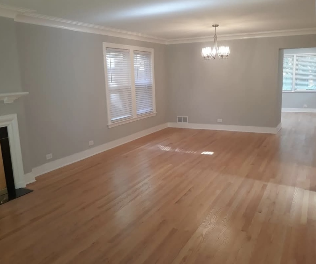 Living and dining room with chandelier, part of a full home remodel