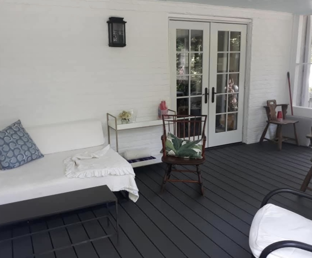 Finished screened-in porch furnished as an outdoor living space
